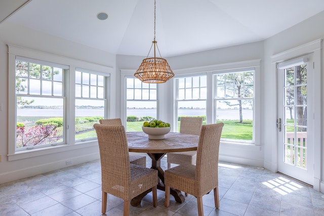 22 Channel Cove Ln, Biddeford, ME 04005 - dining space with plenty of natural light, lofted ceiling, a water view, and a chandelier