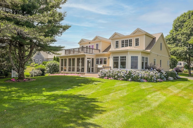 22 Channel Cove Ln, Biddeford, ME 04005 - back of property with a balcony, a sunroom, and a lawn