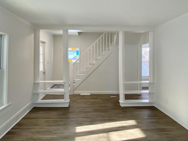 interior space featuring crown molding and hardwood / wood-style floors