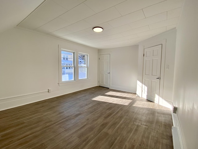 spare room with dark hardwood / wood-style floors