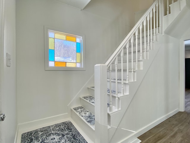 stairs with hardwood / wood-style floors