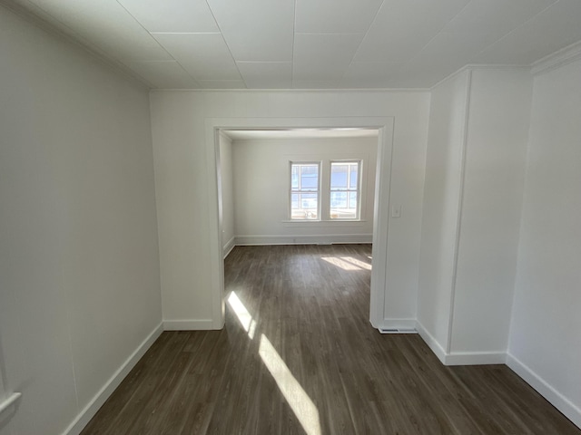 empty room with dark wood-type flooring