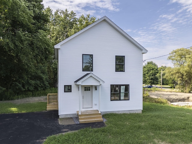 view of front of property with a front lawn