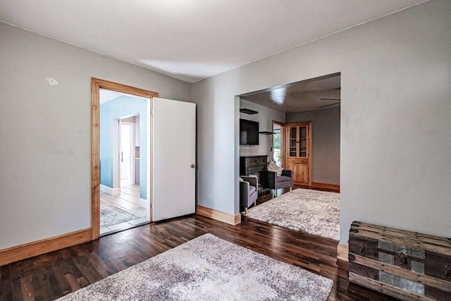 empty room featuring dark hardwood / wood-style flooring and ceiling fan