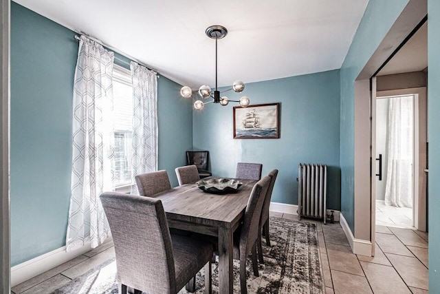 tiled dining area featuring radiator heating unit and a notable chandelier