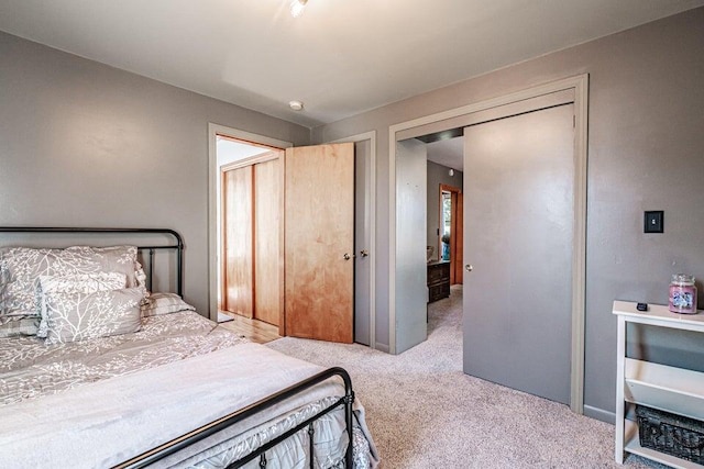 carpeted bedroom featuring a closet