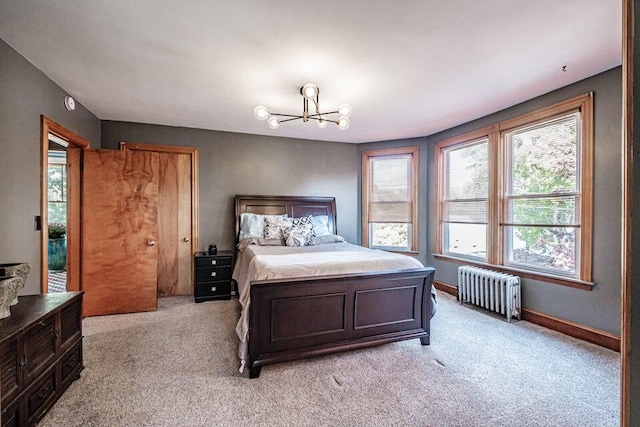 carpeted bedroom with radiator