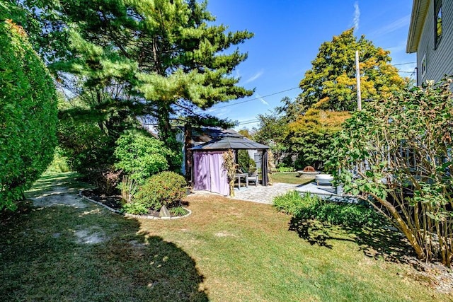 view of yard featuring a gazebo and a patio