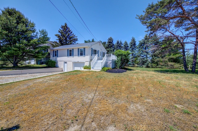3 Sea Breeze Ave, Biddeford, ME 04005 - view of front facade with a garage, stairway, and a front lawn