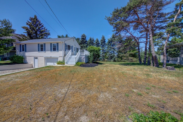 3 Sea Breeze Ave, Biddeford, ME 04005 - view of front of property with an attached garage, stairs, and a front lawn