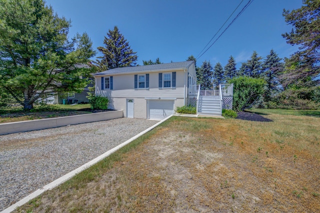 3 Sea Breeze Ave, Biddeford, ME 04005 - bi-level home featuring stairway, driveway, a garage, and a wooden deck