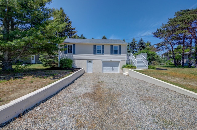 3 Sea Breeze Ave, Biddeford, ME 04005 - view of front of house with driveway, stairway, and an attached garage