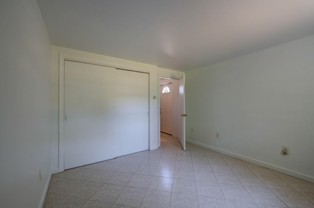 3 Sea Breeze Ave, Biddeford, ME 04005 - unfurnished bedroom featuring a closet and light tile patterned floors