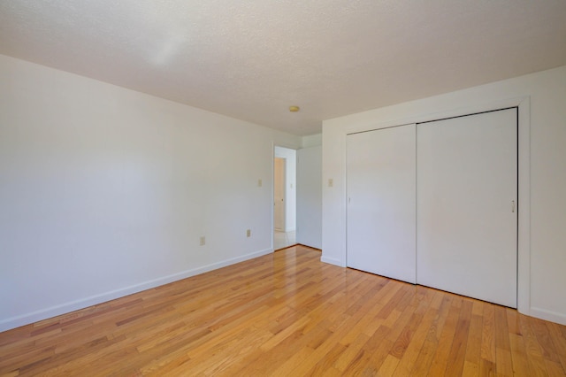3 Sea Breeze Ave, Biddeford, ME 04005 - unfurnished bedroom with light wood-style flooring and a closet