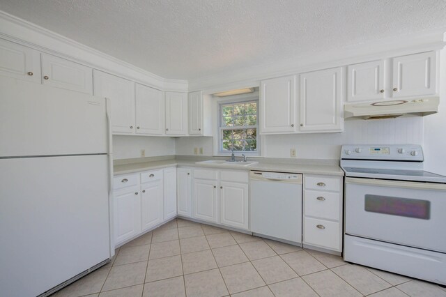 3 Sea Breeze Ave, Biddeford, ME 04005 - kitchen with white appliances, under cabinet range hood, light countertops, white cabinetry, and a textured ceiling