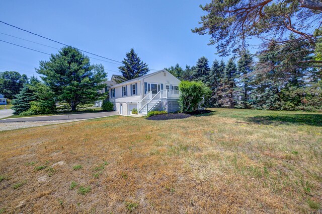3 Sea Breeze Ave, Biddeford, ME 04005 - view of side of property featuring stairs, an attached garage, a lawn, and driveway