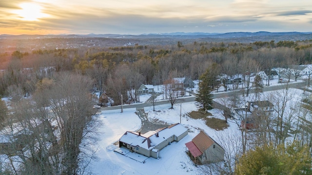 snowy aerial view with a mountain view