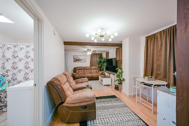 living room with ceiling fan with notable chandelier and light wood-type flooring