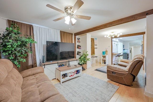 living room with beam ceiling, ceiling fan with notable chandelier, and light hardwood / wood-style floors