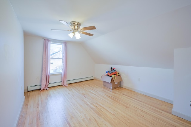 additional living space with ceiling fan, lofted ceiling, and light hardwood / wood-style flooring