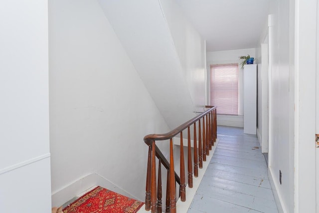 stairs featuring wood-type flooring