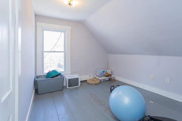 bonus room featuring lofted ceiling, hardwood / wood-style flooring, and baseboard heating