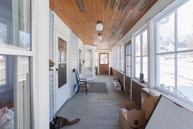 sunroom / solarium featuring wood ceiling