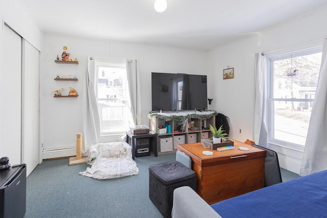 carpeted living room with a baseboard radiator and crown molding