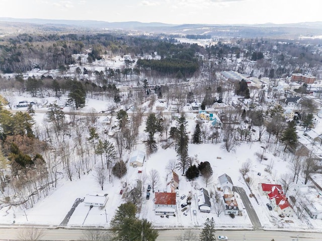 snowy aerial view with a mountain view