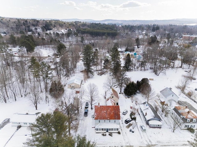 snowy aerial view with a mountain view