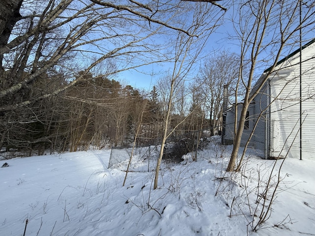 view of yard layered in snow