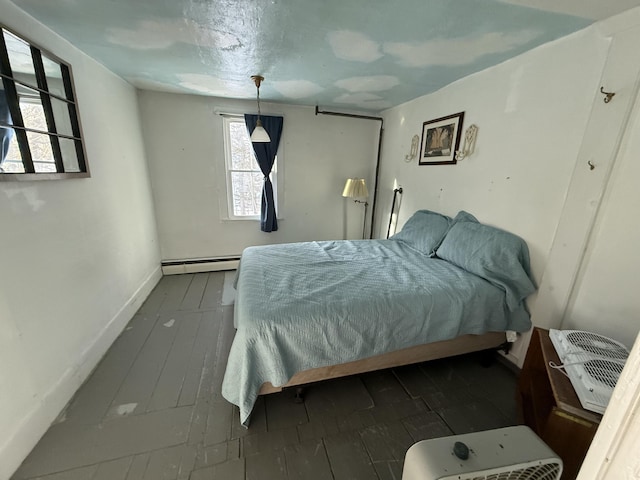 bedroom featuring a baseboard heating unit