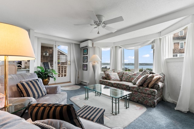 living room with a wall unit AC, carpet flooring, a textured ceiling, a ceiling fan, and a baseboard radiator