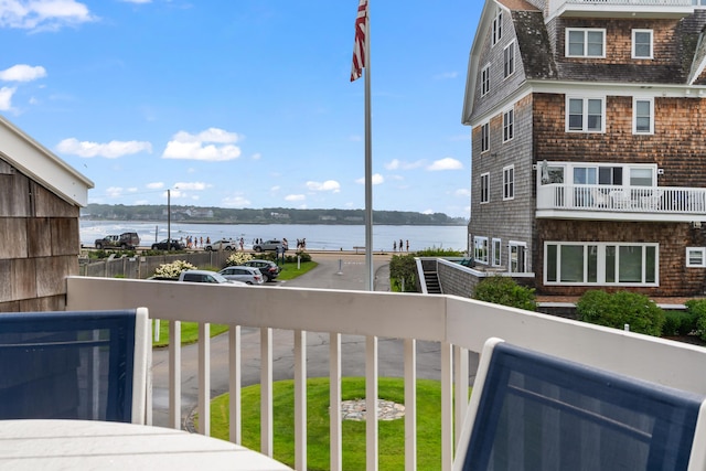 balcony featuring a water view