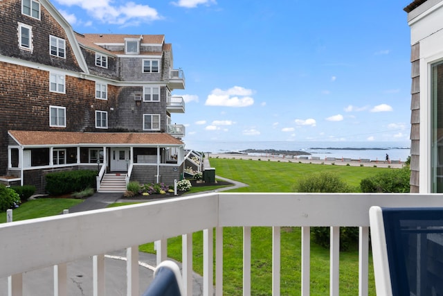 balcony featuring a water view