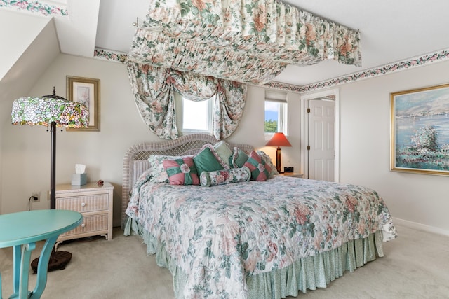 bedroom featuring carpet and baseboards