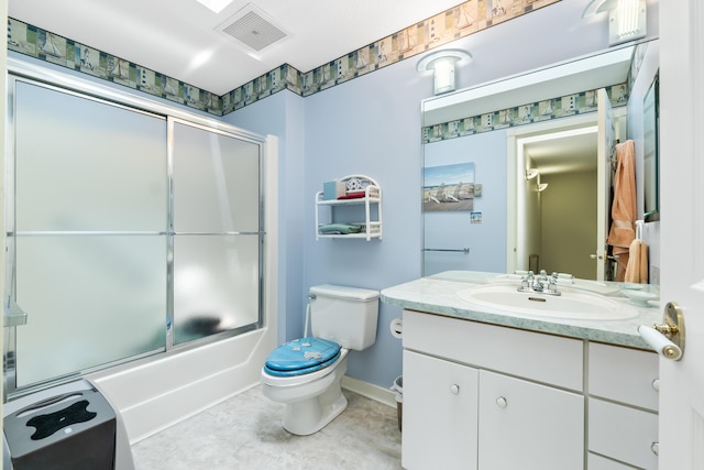 bathroom featuring visible vents, toilet, shower / bath combination with glass door, tile patterned floors, and vanity