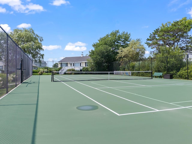 view of sport court featuring community basketball court and fence