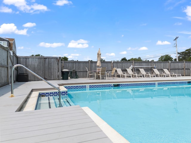 view of pool with a fenced in pool, a fenced backyard, and a patio area