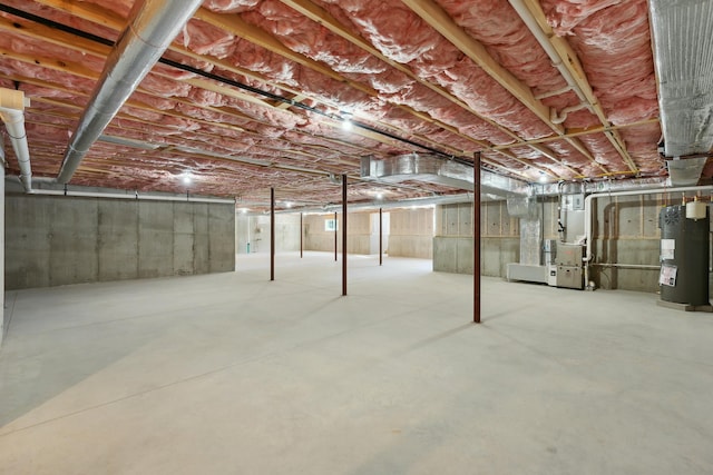 basement with heating unit and electric water heater