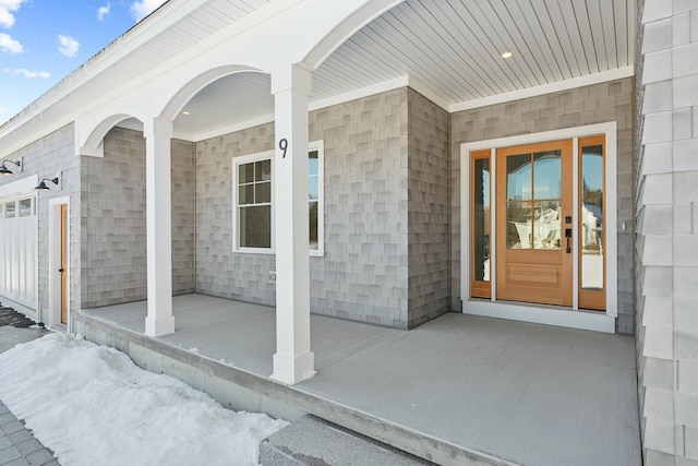 doorway to property featuring a porch