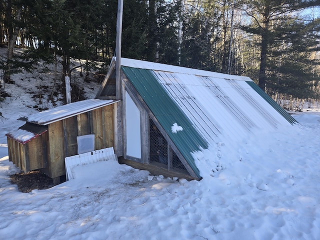 view of storm shelter with an outbuilding