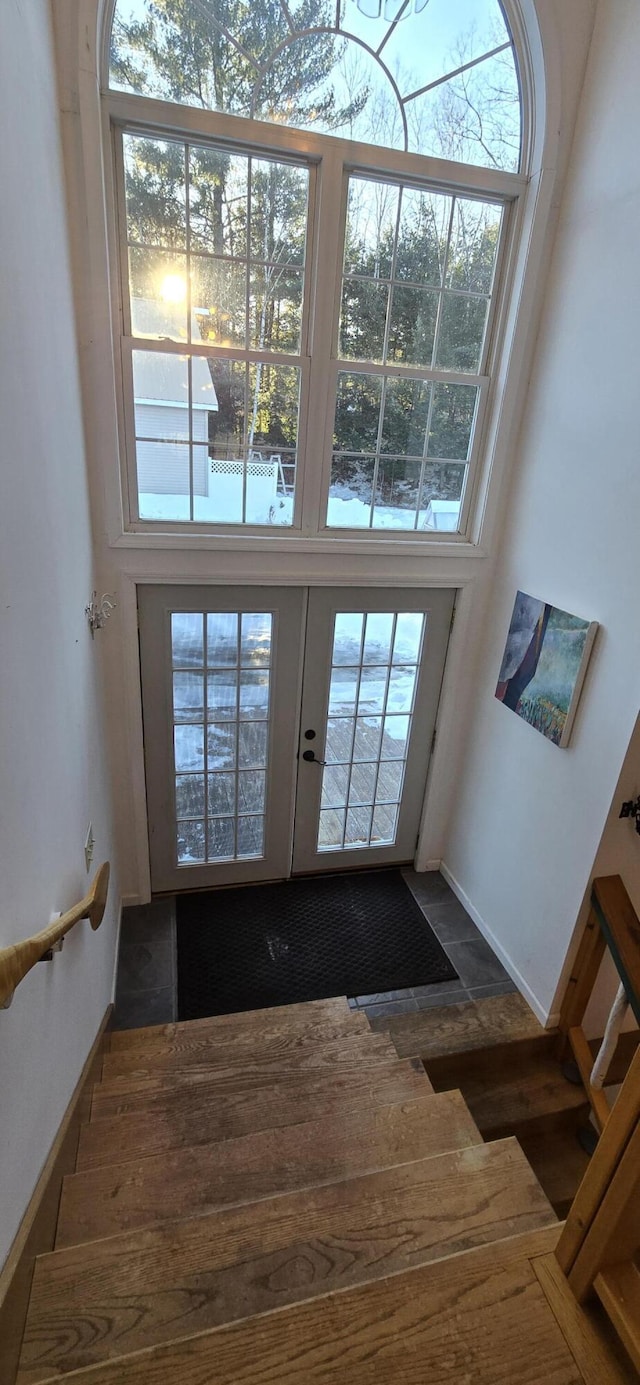 doorway to outside with a high ceiling