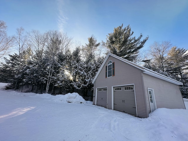 view of snow covered garage