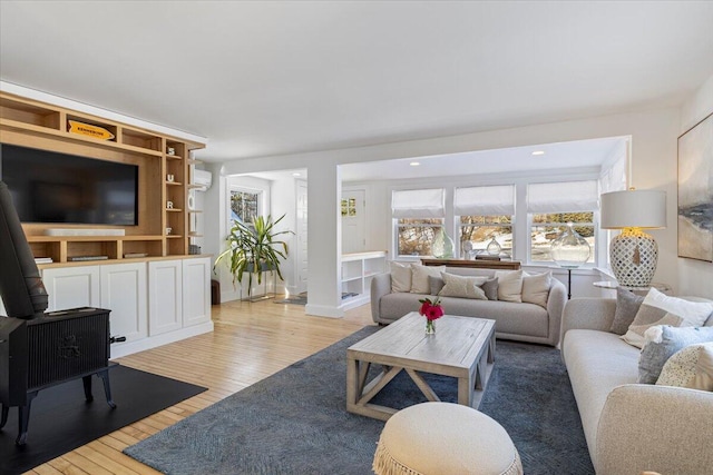 living room with light hardwood / wood-style flooring