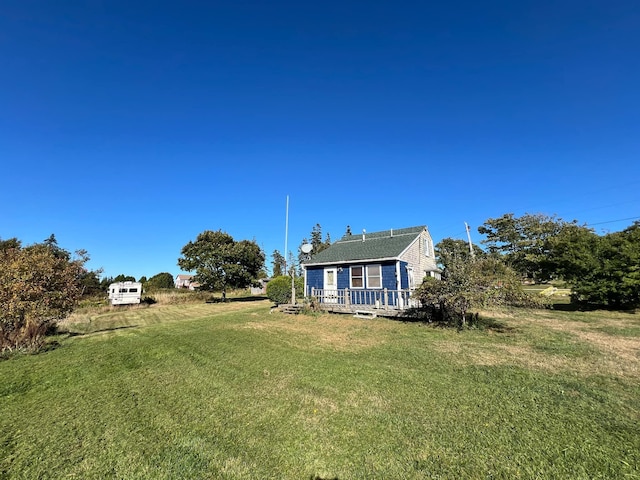 view of yard with a wooden deck