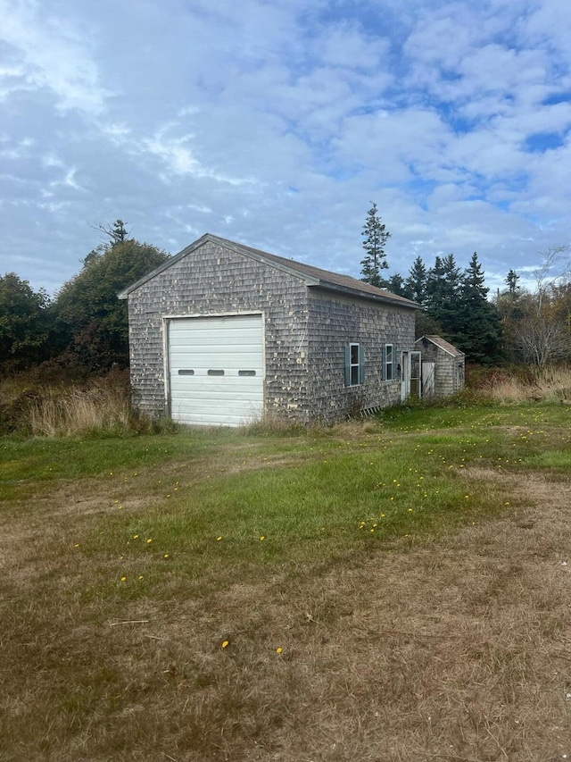 garage with a yard