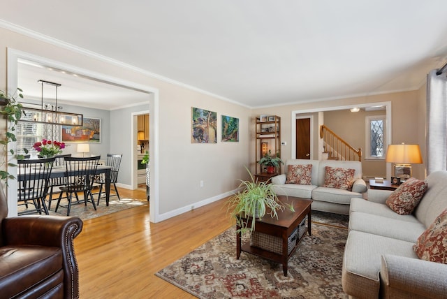 living room featuring ornamental molding and hardwood / wood-style floors