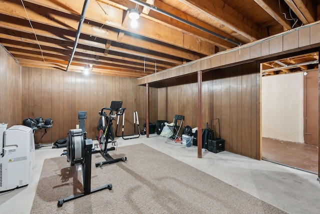 exercise room with wood walls