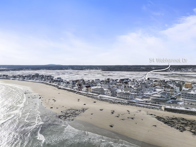 bird's eye view featuring a view of the beach and a water view